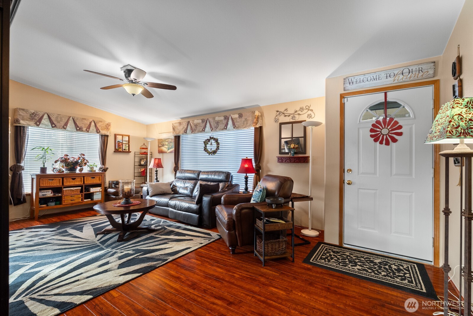 9314 Canyon Road East, Unit 39 Puyallup, WA 98371 - Photo 10 of 27 a living room with furniture a rug and a window