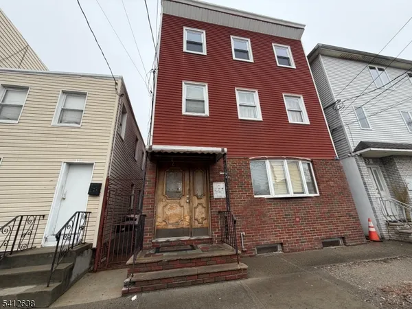 a front view of a house with stairs