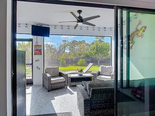 a view of a livingroom with furniture and window
