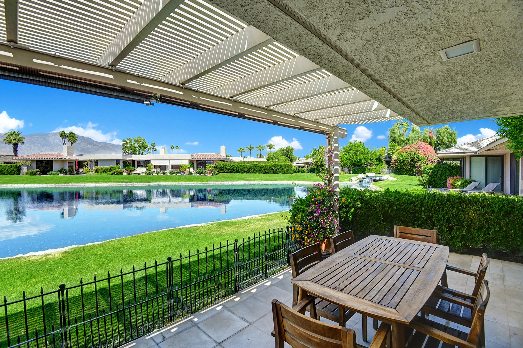 6 Colgate Drive Rancho Mirage, CA 92270 - Photo 21 of 32 a view of a house with a lake view