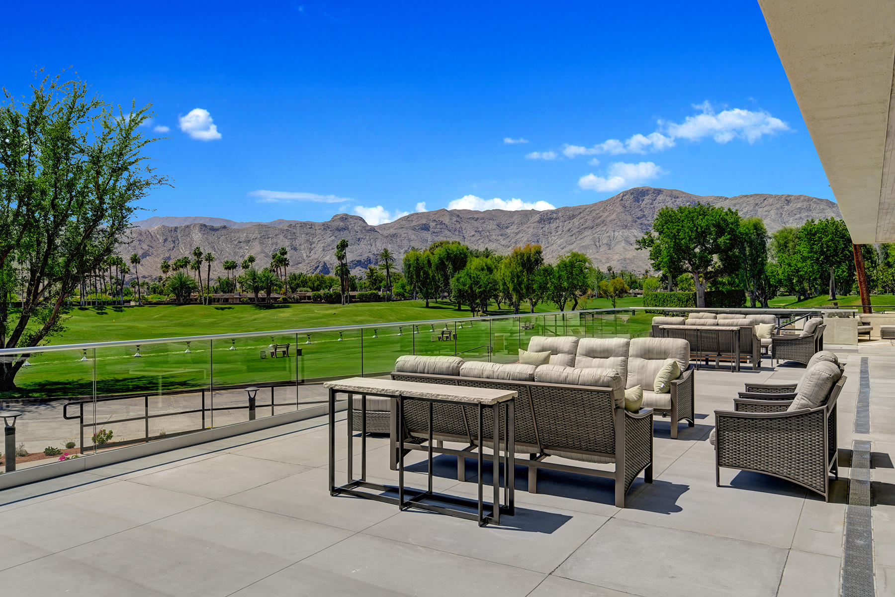 6 Colgate Drive Rancho Mirage, CA 92270 - Photo 28 of 32 a view of a patio with chairs and a table