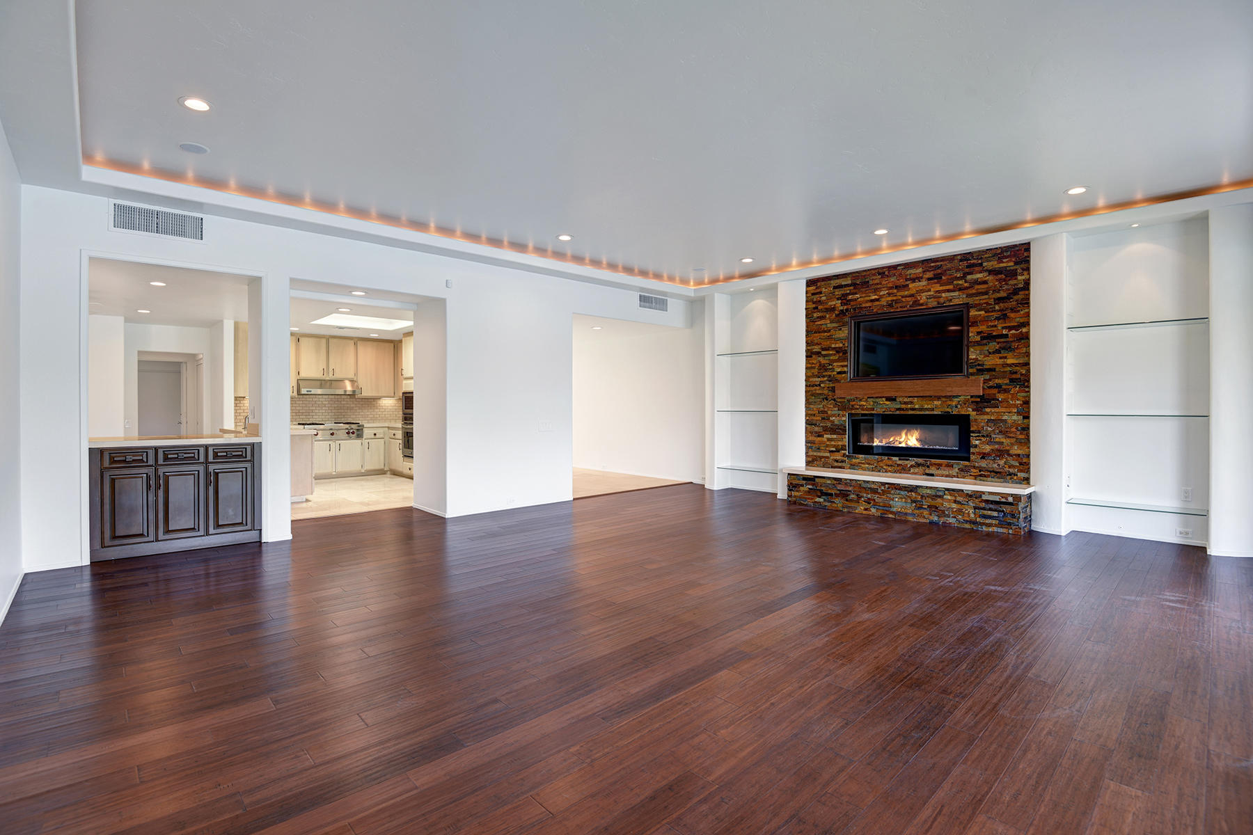 6 Colgate Drive Rancho Mirage, CA 92270 - Photo 4 of 32 a view of a room with wooden floor fire place and windows