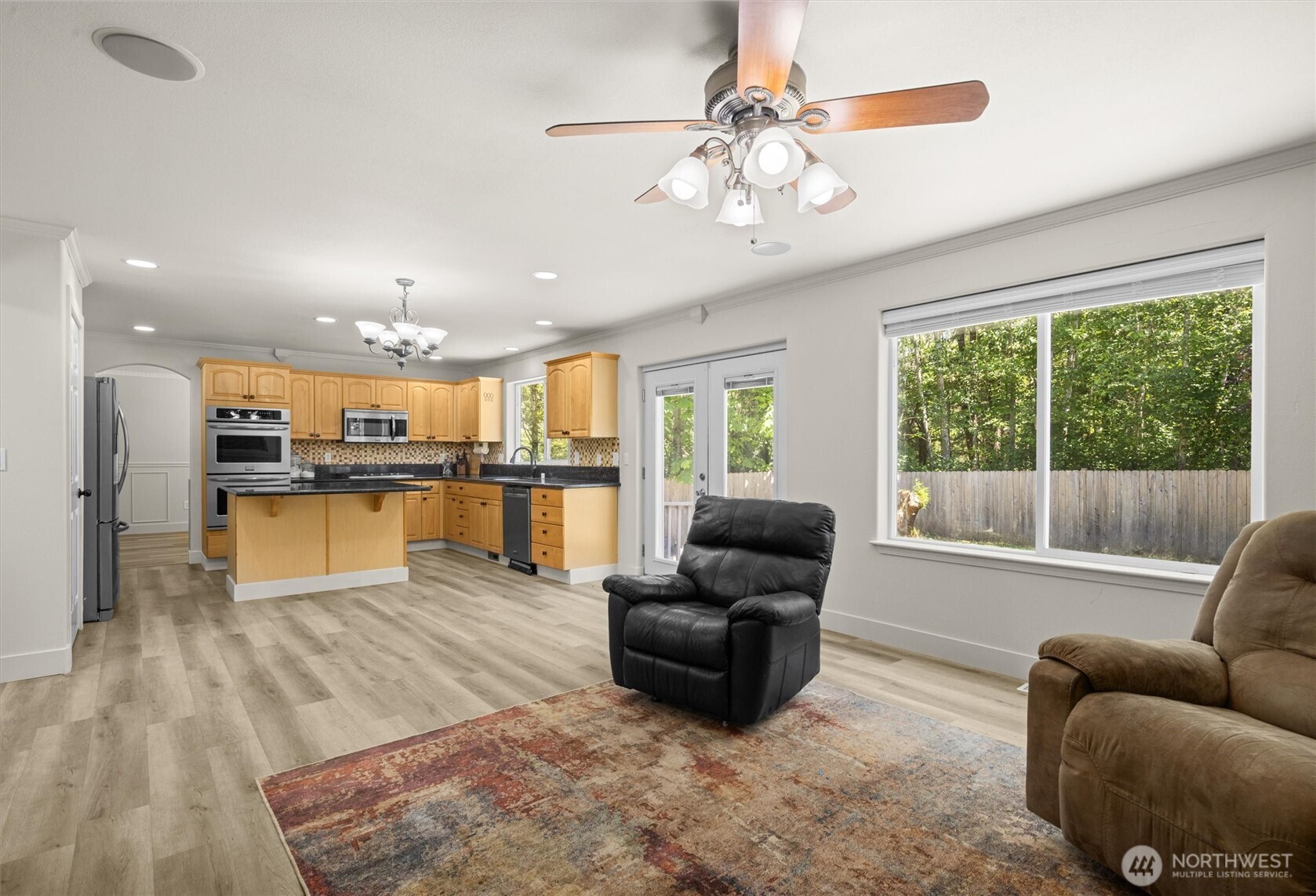 13901 Cedar Court Sultan, WA 98294 - Photo 13 of 34 a living room with furniture and kitchen view