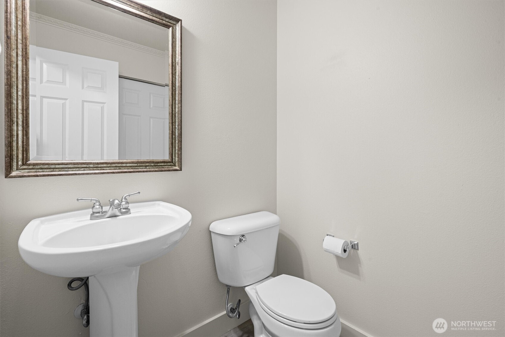 13901 Cedar Court Sultan, WA 98294 - Photo 16 of 34 a bathroom with a toilet a sink and mirror
