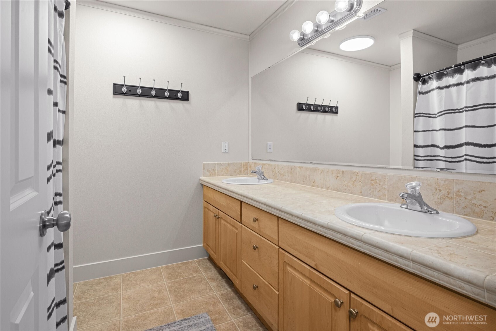 13901 Cedar Court Sultan, WA 98294 - Photo 20 of 34 a bathroom with a granite countertop sink a large mirror and shower