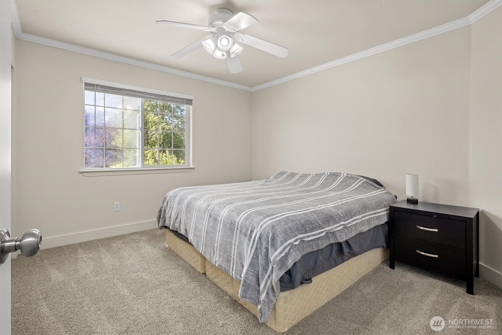 13901 Cedar Court Sultan, WA 98294 - Photo 21 of 34 a bedroom with a bed and a chandelier