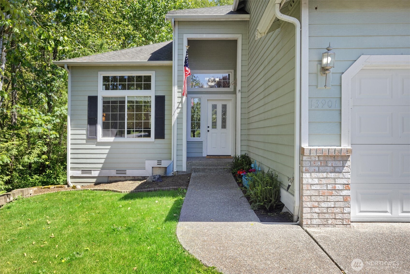 13901 Cedar Court Sultan, WA 98294 - Photo 3 of 34 a front view of a house with garden