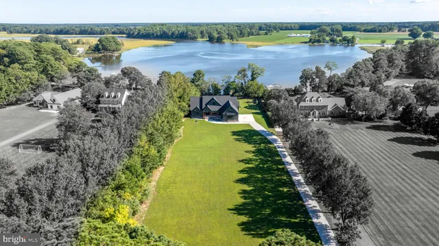 a view of a lake with a yard and lake view