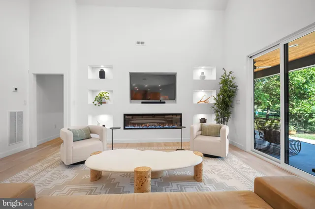 a large kitchen with stainless steel appliances lots of counter space and a sink