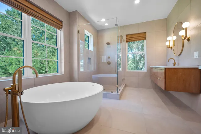 a view of a kitchen with a sink and dishwasher with wooden floor