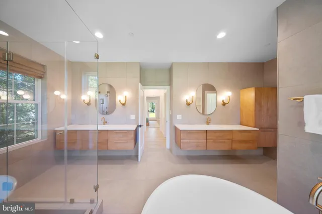 a front view of a house with swimming pool and porch with furniture