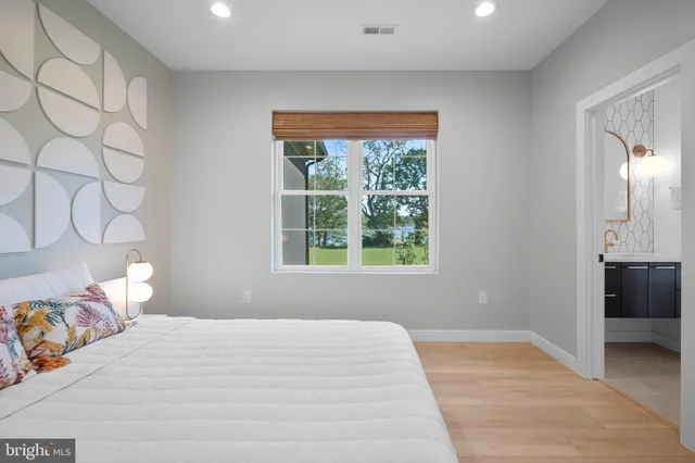 a view of a lake with a house in the background