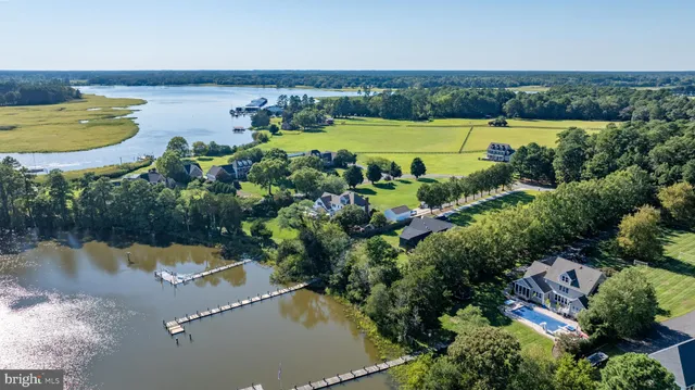 an aerial view of beach and swimming pool