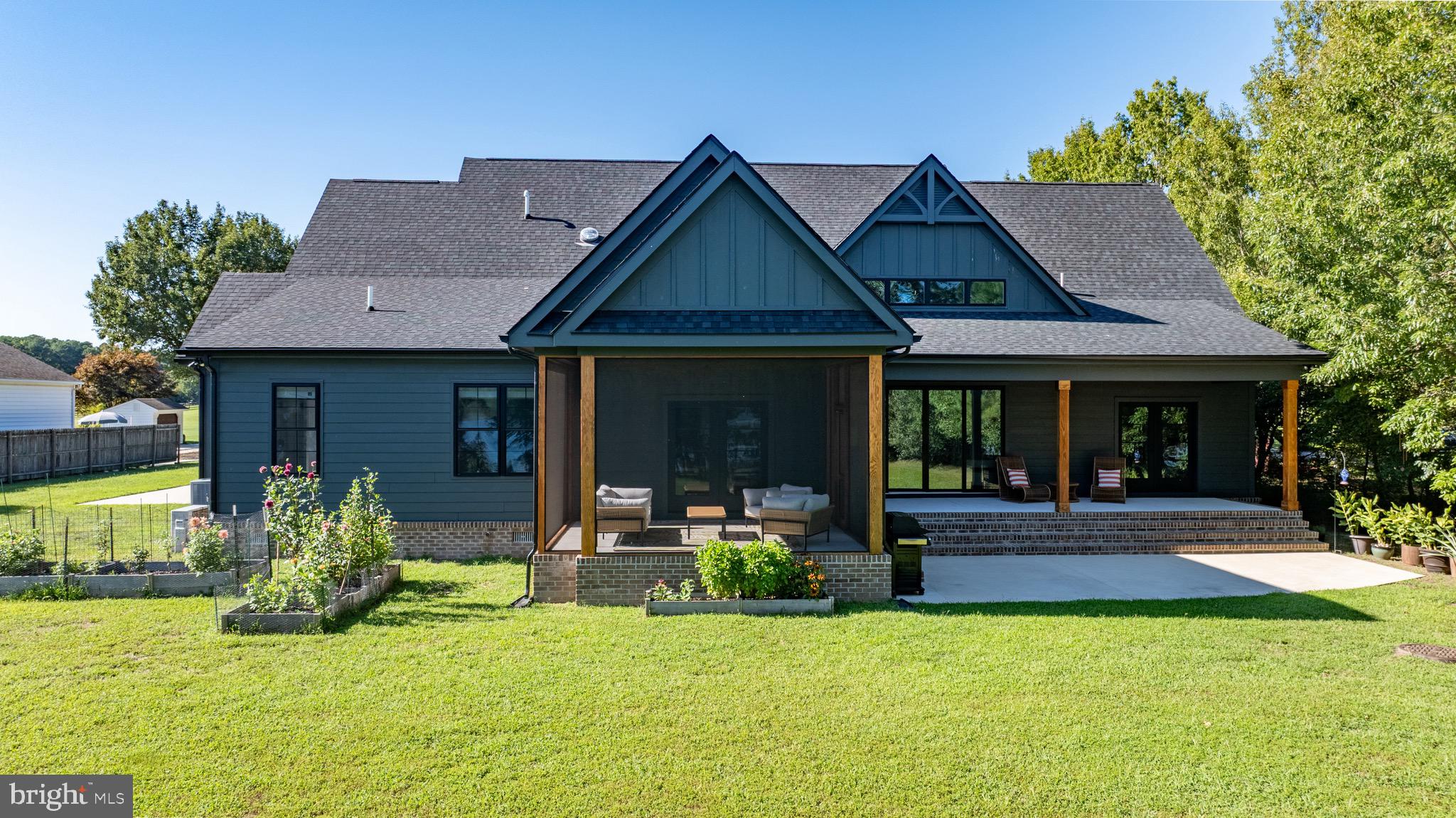 3311 Redden Ferry Road Eden, MD 21822 - Photo 59 of 75 a front view of a house with swimming pool and porch with furniture