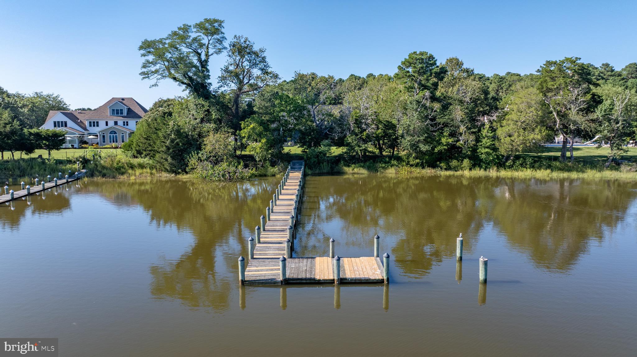 3311 Redden Ferry Road Eden, MD 21822 - Photo 63 of 75 a view of a lake with a house in the background