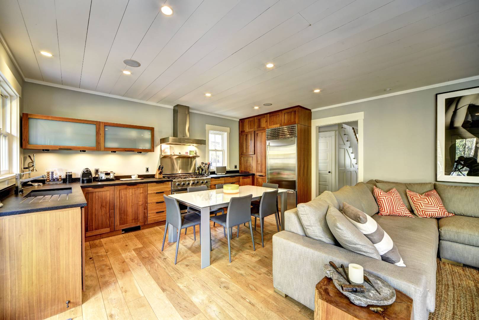 18 Glover Street Sag Harbor, NY 11963 - Photo 12 of 26 a kitchen with a table chairs stove and refrigerator