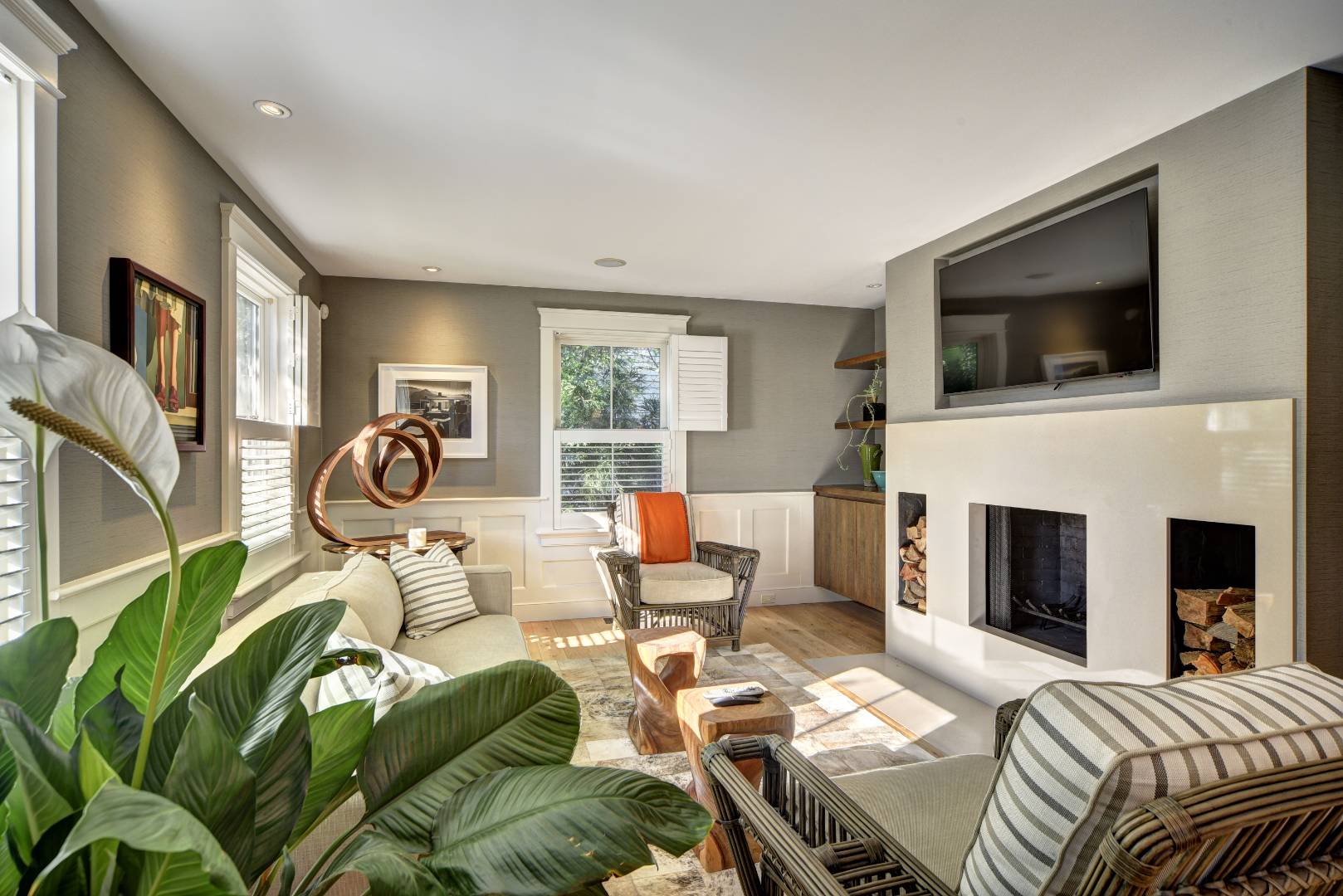 18 Glover Street Sag Harbor, NY 11963 - Photo 15 of 26 a living room with furniture a fireplace and a flat screen tv