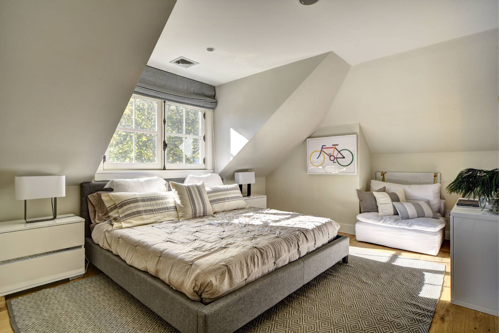 18 Glover Street Sag Harbor, NY 11963 - Photo 22 of 26 a bedroom with a large bed and a window