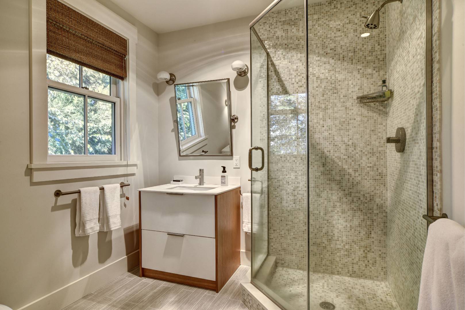 18 Glover Street Sag Harbor, NY 11963 - Photo 23 of 26 a bathroom with a shower sink and mirror