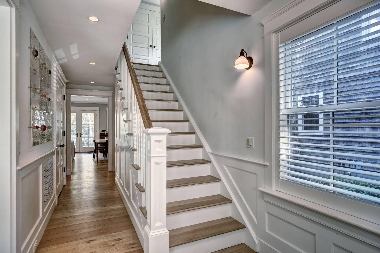 18 Glover Street Sag Harbor, NY 11963 - Photo 24 of 26 a view of a hallway with wooden floor and stairs