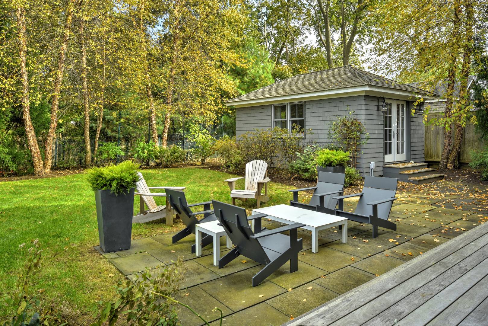 18 Glover Street Sag Harbor, NY 11963 - Photo 5 of 26 a view of a house with backyard sitting area and garden