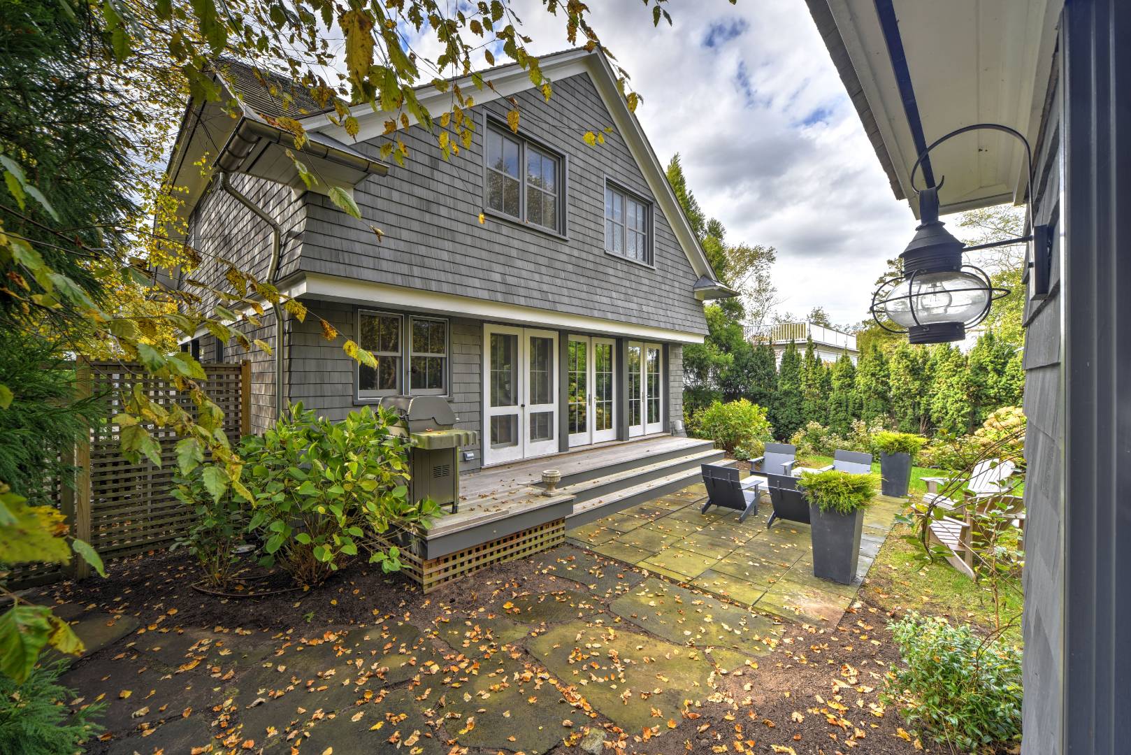 18 Glover Street Sag Harbor, NY 11963 - Photo 6 of 26 a view of a house with sitting area and garden