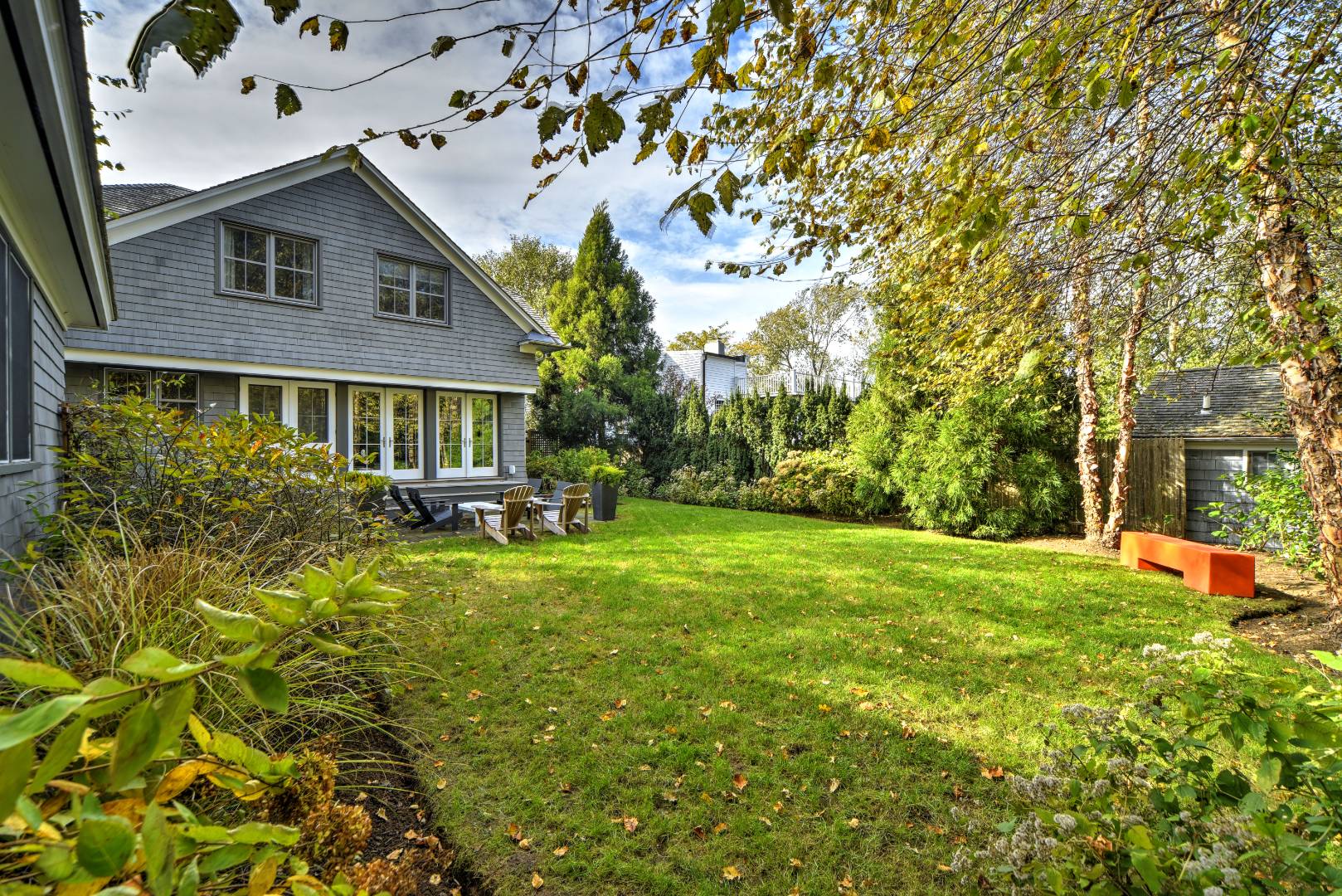 18 Glover Street Sag Harbor, NY 11963 - Photo 7 of 26 a front view of a house with a yard