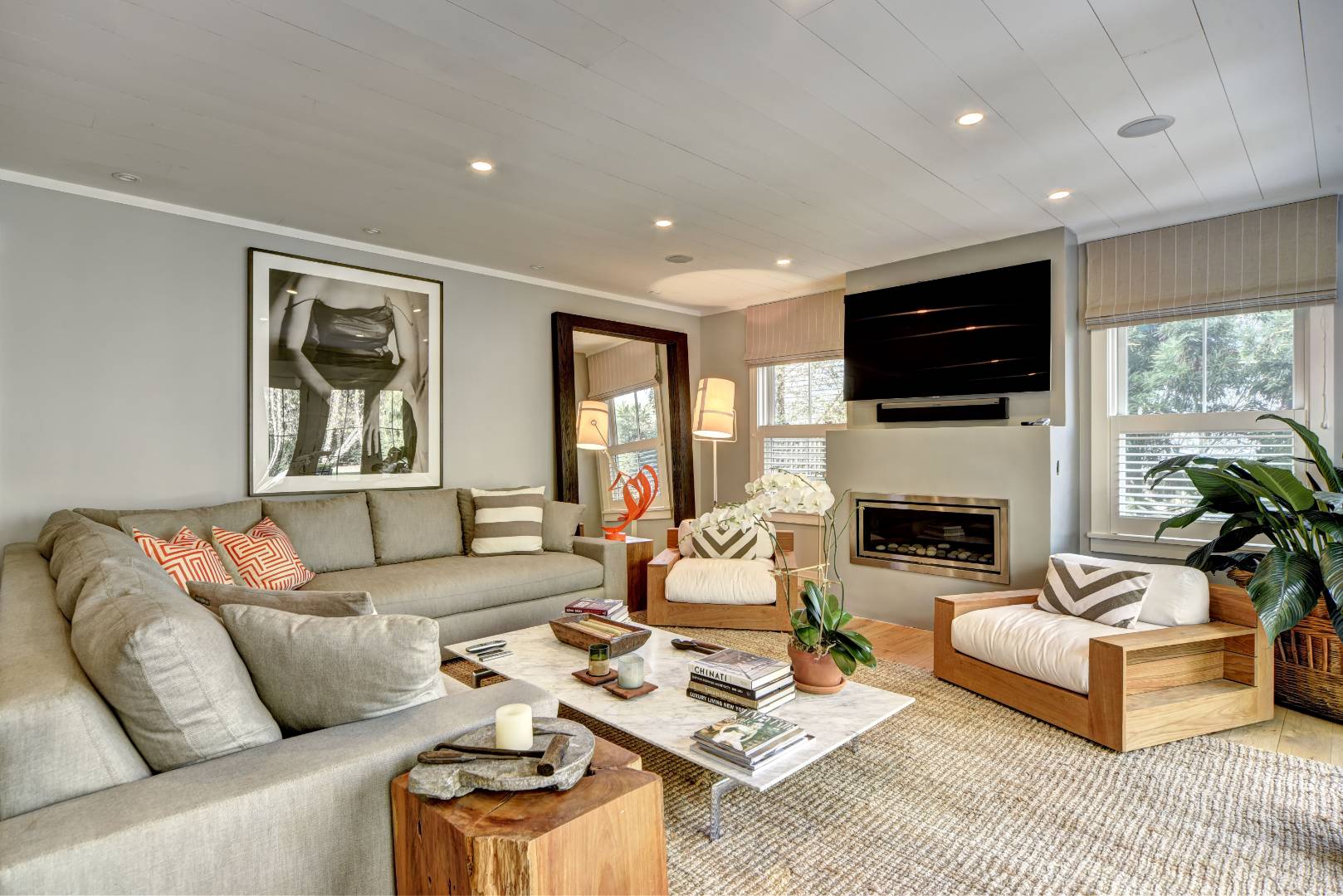 18 Glover Street Sag Harbor, NY 11963 - Photo 8 of 26 a living room with furniture a fireplace and a flat screen tv