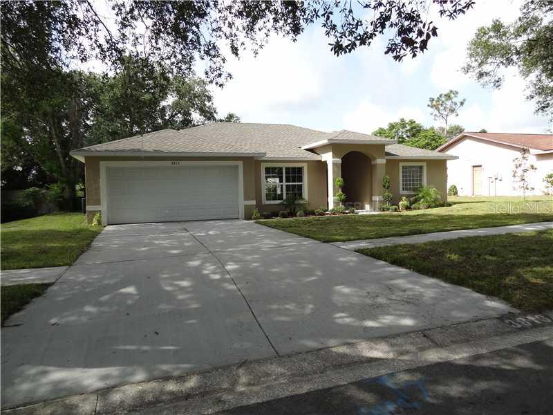 2413 Durant Road Valrico, FL 33596 - Photo 1 of 1 a front view of a house with a garden
