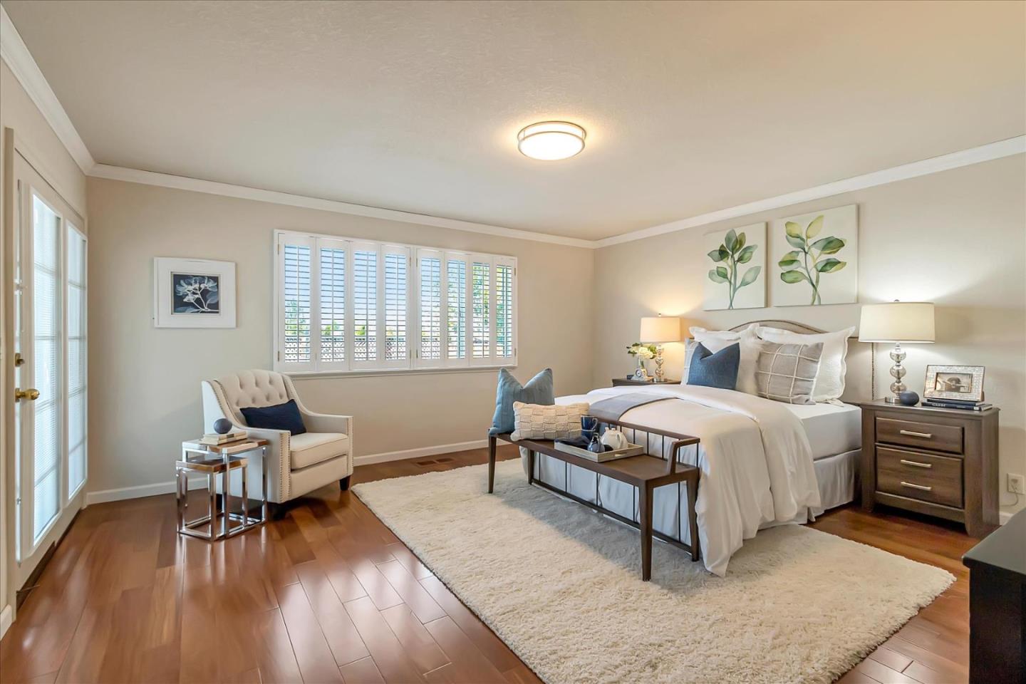 18809 Cabernet Drive Saratoga, CA 95070 - Photo 13 of 29 a bedroom with a bed and wooden floor