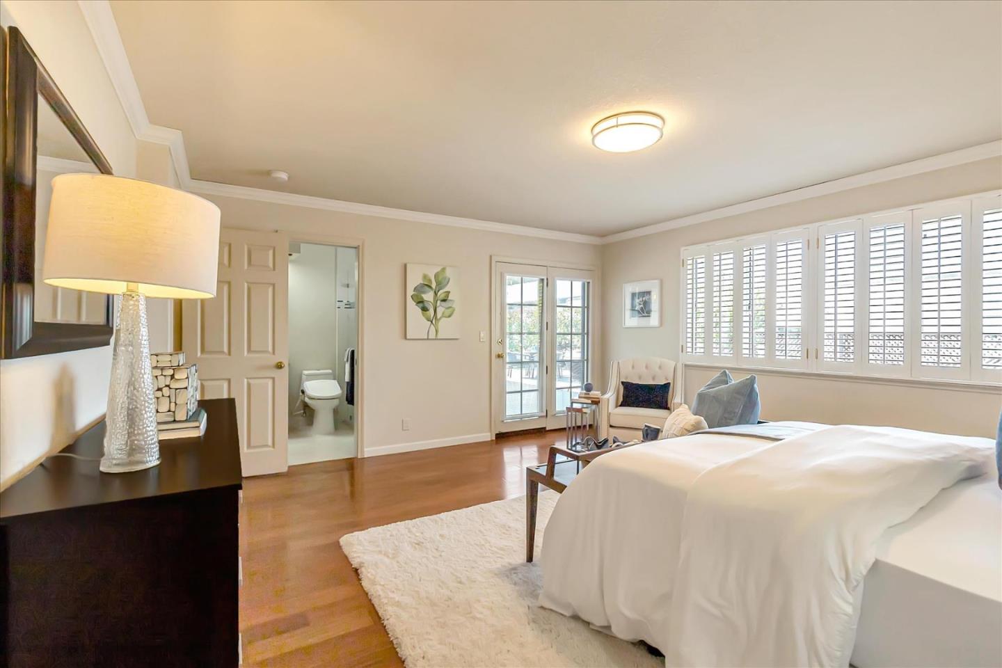 18809 Cabernet Drive Saratoga, CA 95070 - Photo 14 of 29 a bed room with a bed and wooden floor