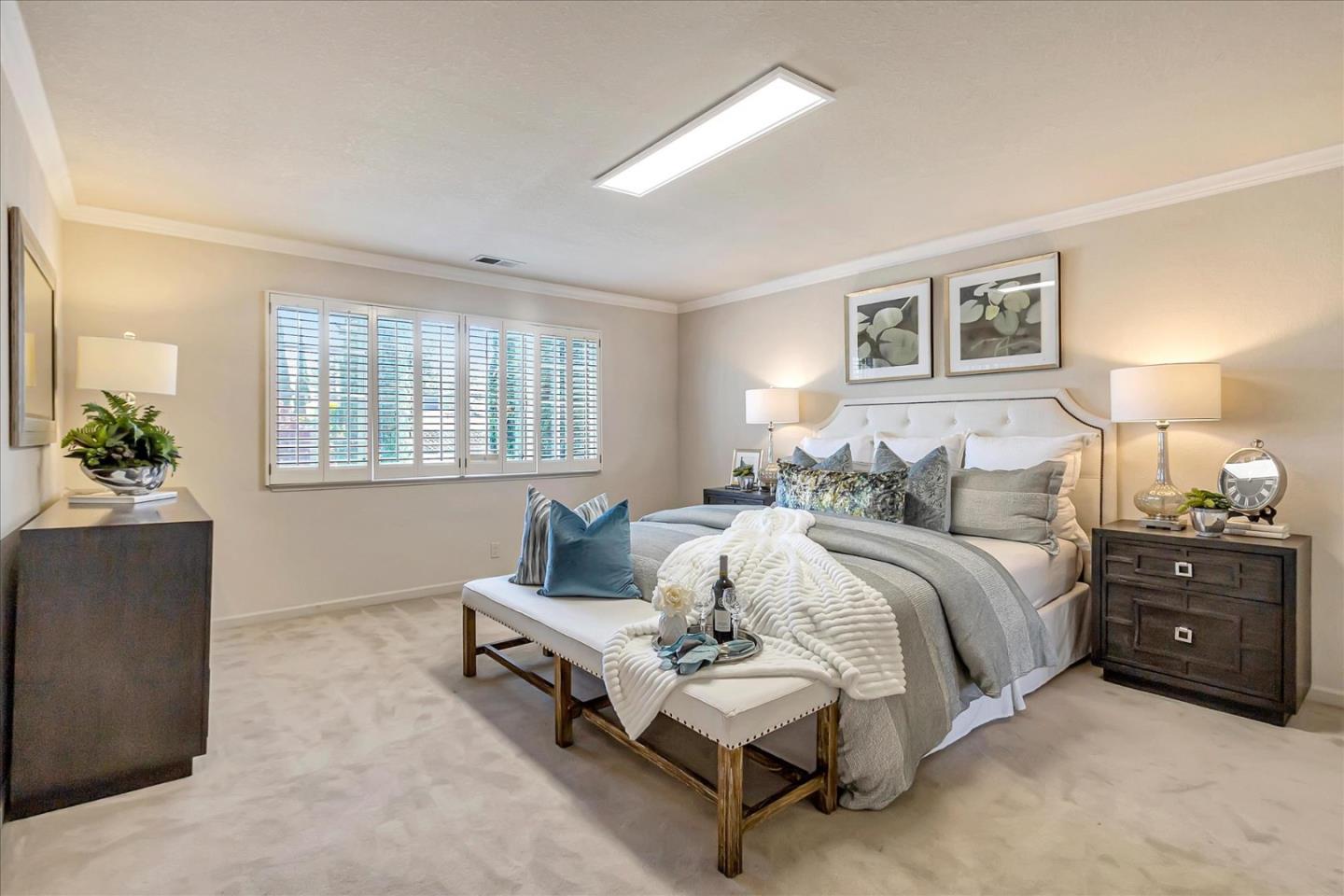 18809 Cabernet Drive Saratoga, CA 95070 - Photo 16 of 29 a spacious bedroom with a bed and a couch