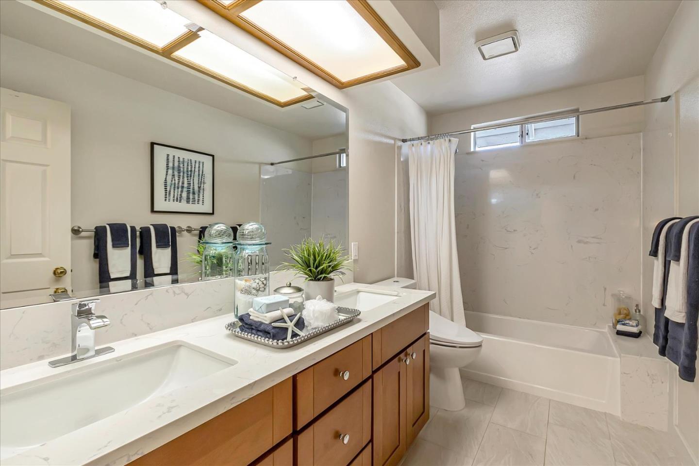 18809 Cabernet Drive Saratoga, CA 95070 - Photo 23 of 29 a bathroom with a sink a toilet and shower