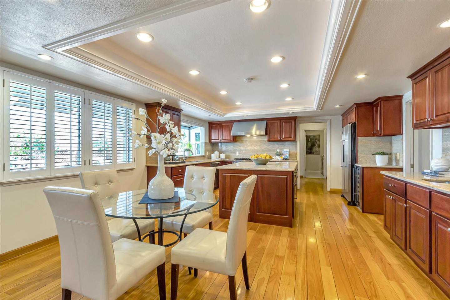 18809 Cabernet Drive Saratoga, CA 95070 - Photo 9 of 29 a dining room with furniture and a kitchen view