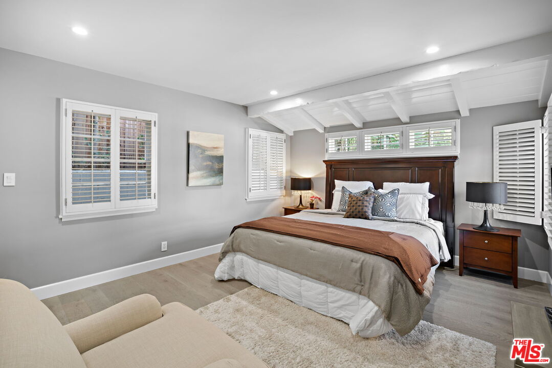 3733 Wrightwood Drive Studio City, CA 91604 - Photo 15 of 49 a bedroom with a bed and a window