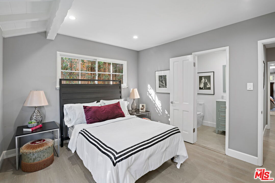 3733 Wrightwood Drive Studio City, CA 91604 - Photo 19 of 49 a bedroom with a bed and a window