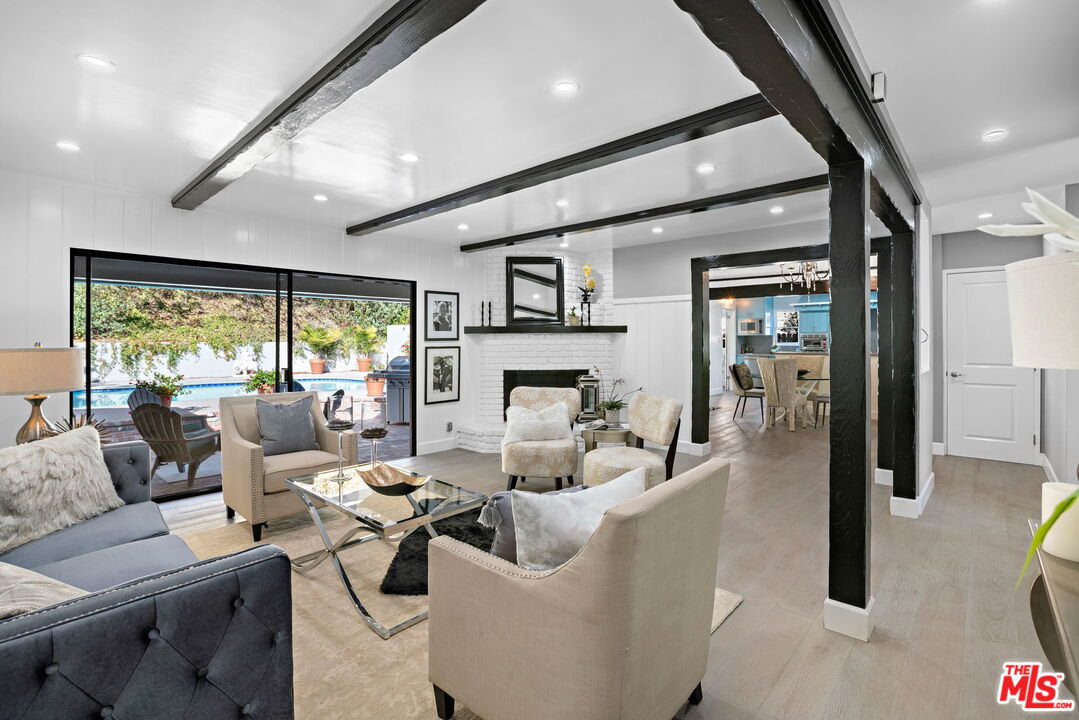 3733 Wrightwood Drive Studio City, CA 91604 - Photo 28 of 49 a living room with fireplace furniture and a large window