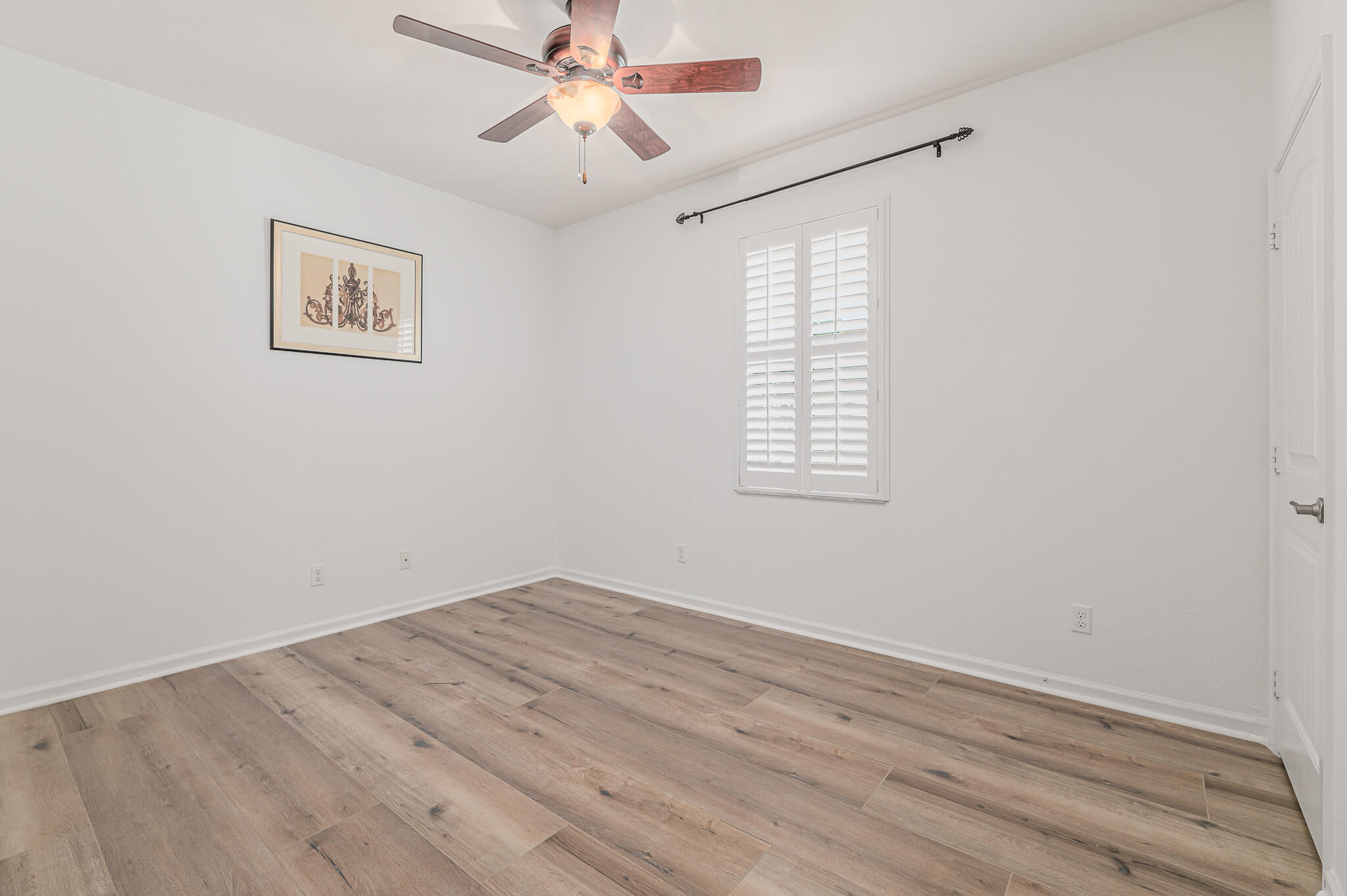 2187 Northwest Dalea Way Stuart, FL 34994 - Photo 14 of 41 wooden floor in an empty room with a window