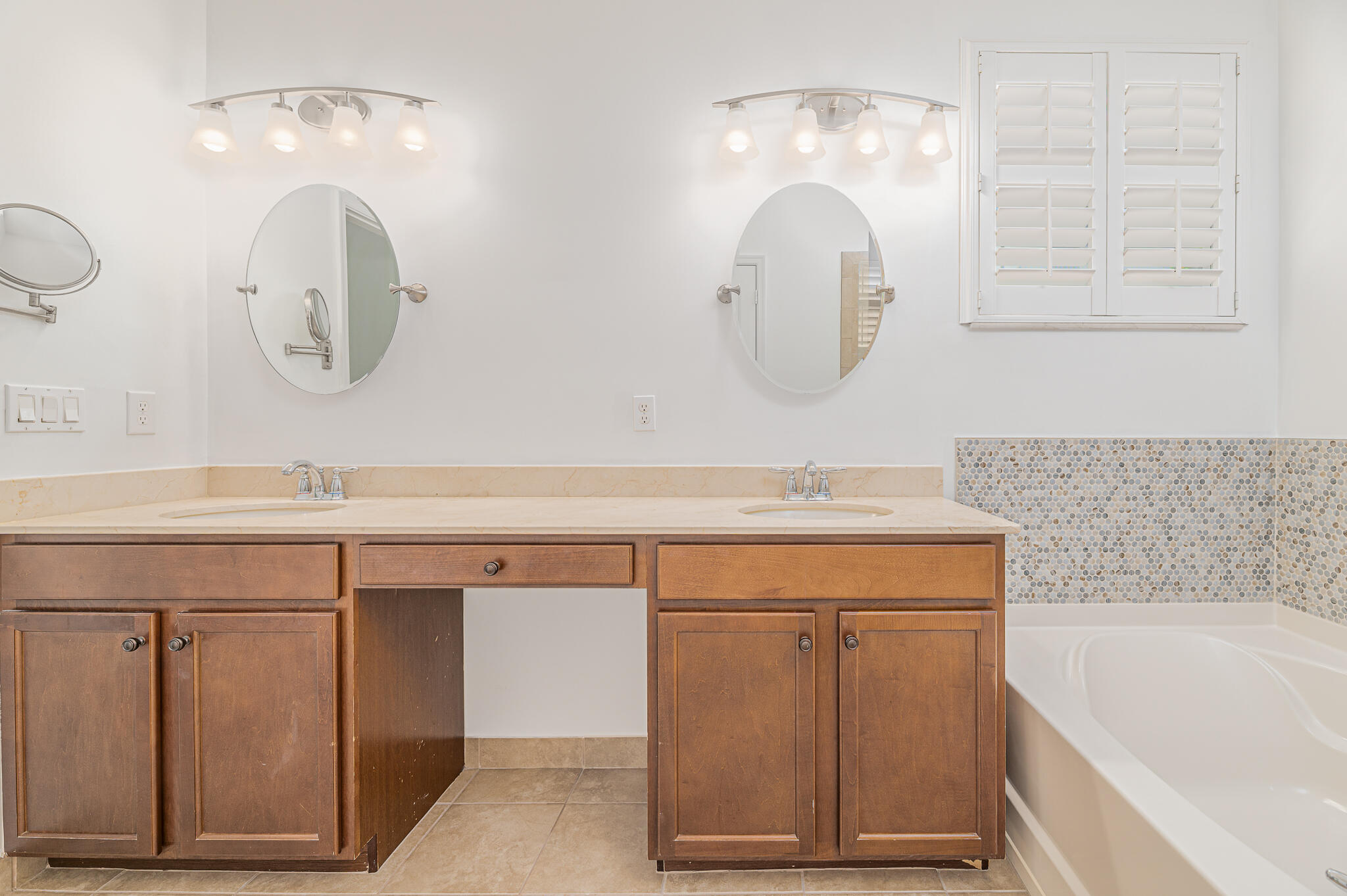 2187 Northwest Dalea Way Stuart, FL 34994 - Photo 24 of 41 a bathroom with a double vanity sink mirror and bathtub