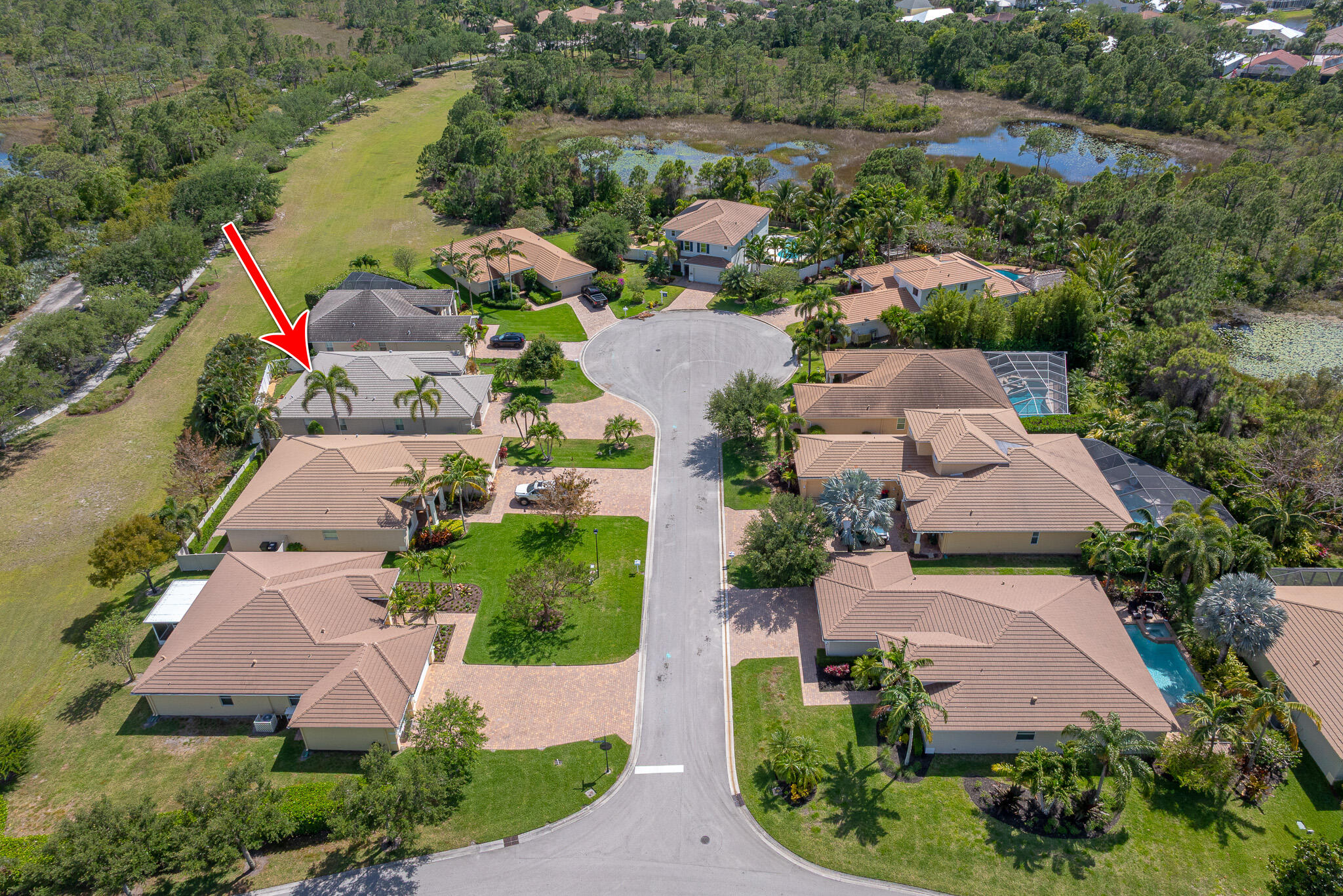 2187 Northwest Dalea Way Stuart, FL 34994 - Photo 38 of 41 an aerial view of a house with a garden and lake view