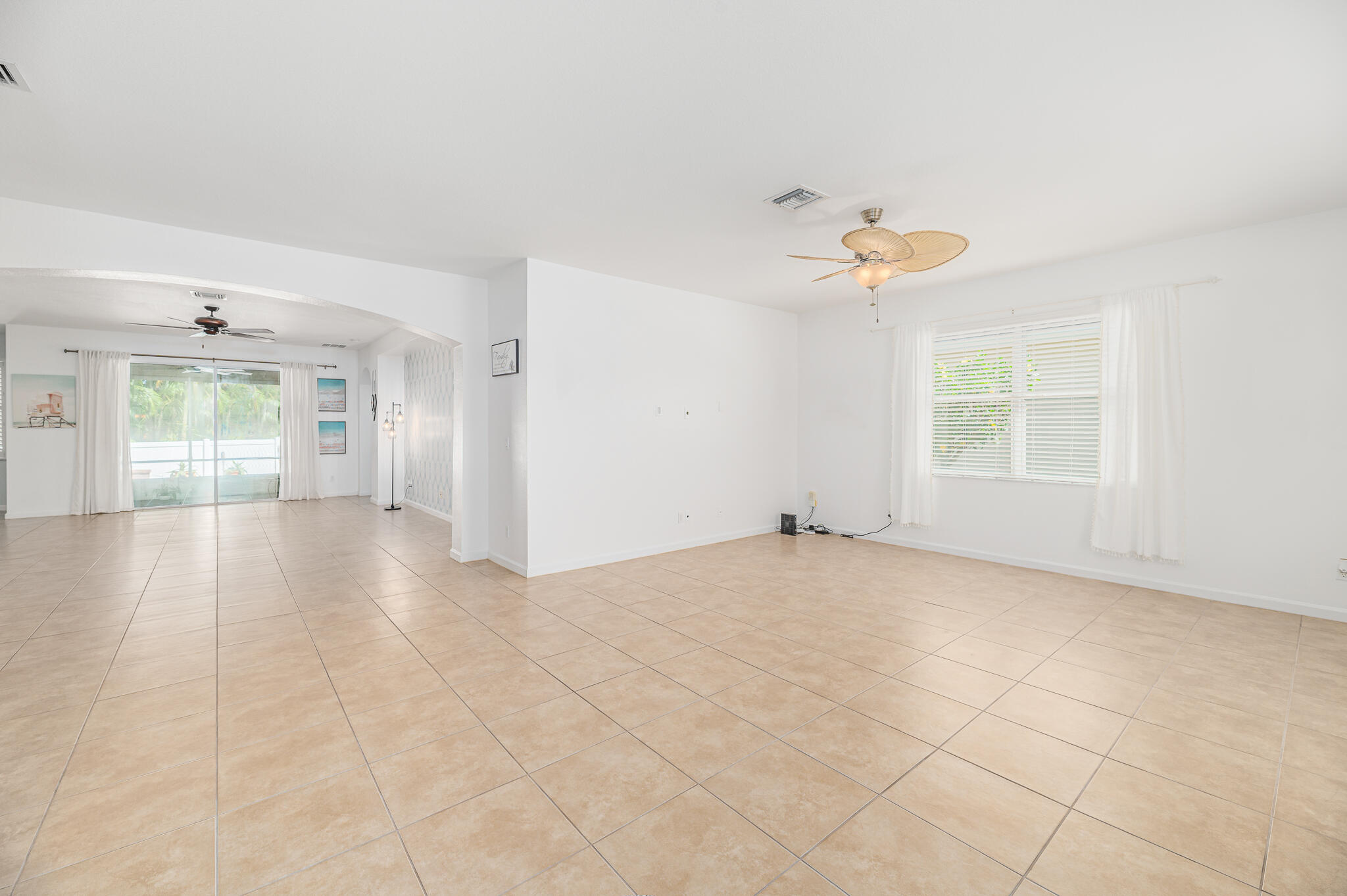 2187 Northwest Dalea Way Stuart, FL 34994 - Photo 6 of 41 a view of an empty room with a window