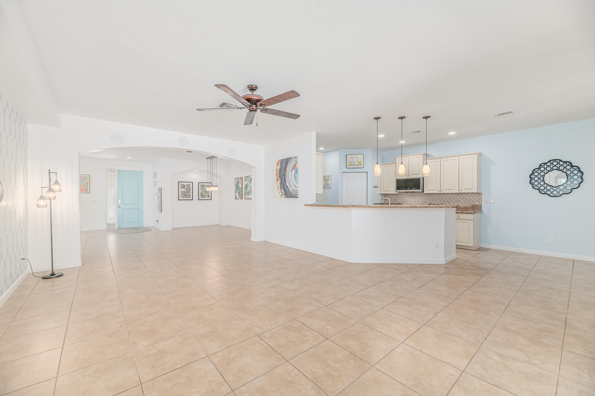 2187 Northwest Dalea Way Stuart, FL 34994 - Photo 8 of 41 a view of a kitchen with furniture and a kitchen view