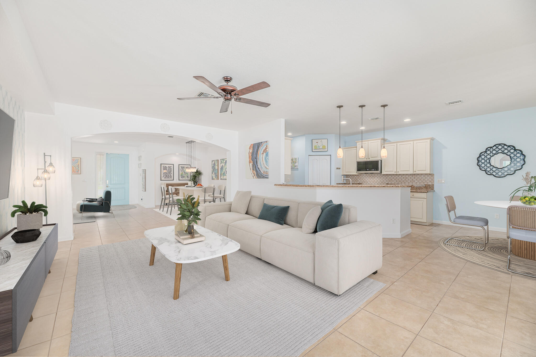 2187 Northwest Dalea Way Stuart, FL 34994 - Photo 9 of 41 a living room with furniture and a chandelier
