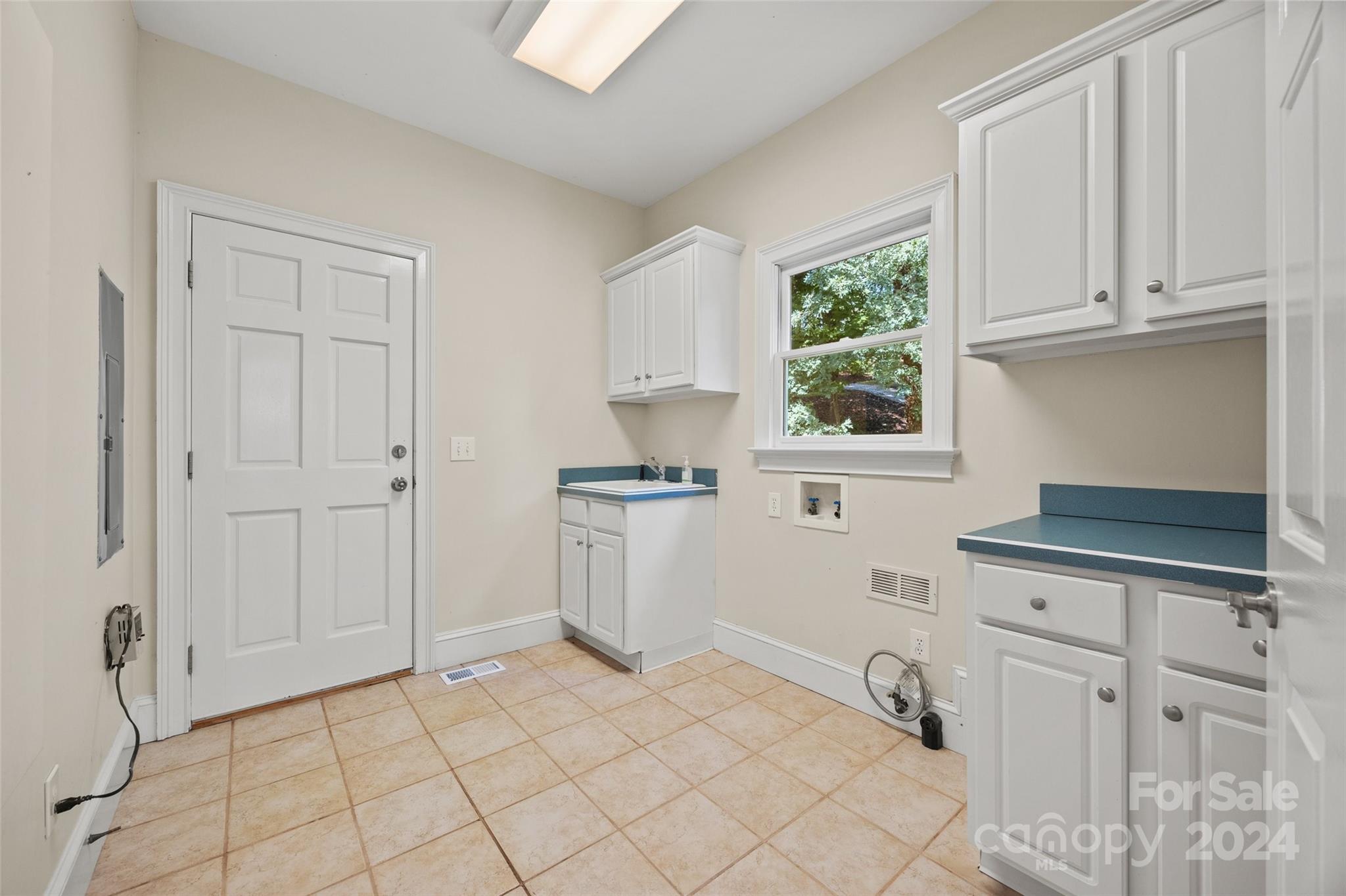 16201 Crest Cove Road Charlotte, NC 28278 - Photo 11 of 48 a view of a kitchen with white cabinets