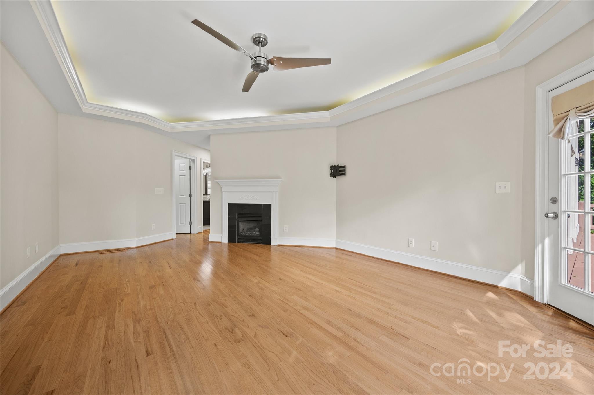16201 Crest Cove Road Charlotte, NC 28278 - Photo 13 of 48 a view of empty room with wooden floor and fireplace