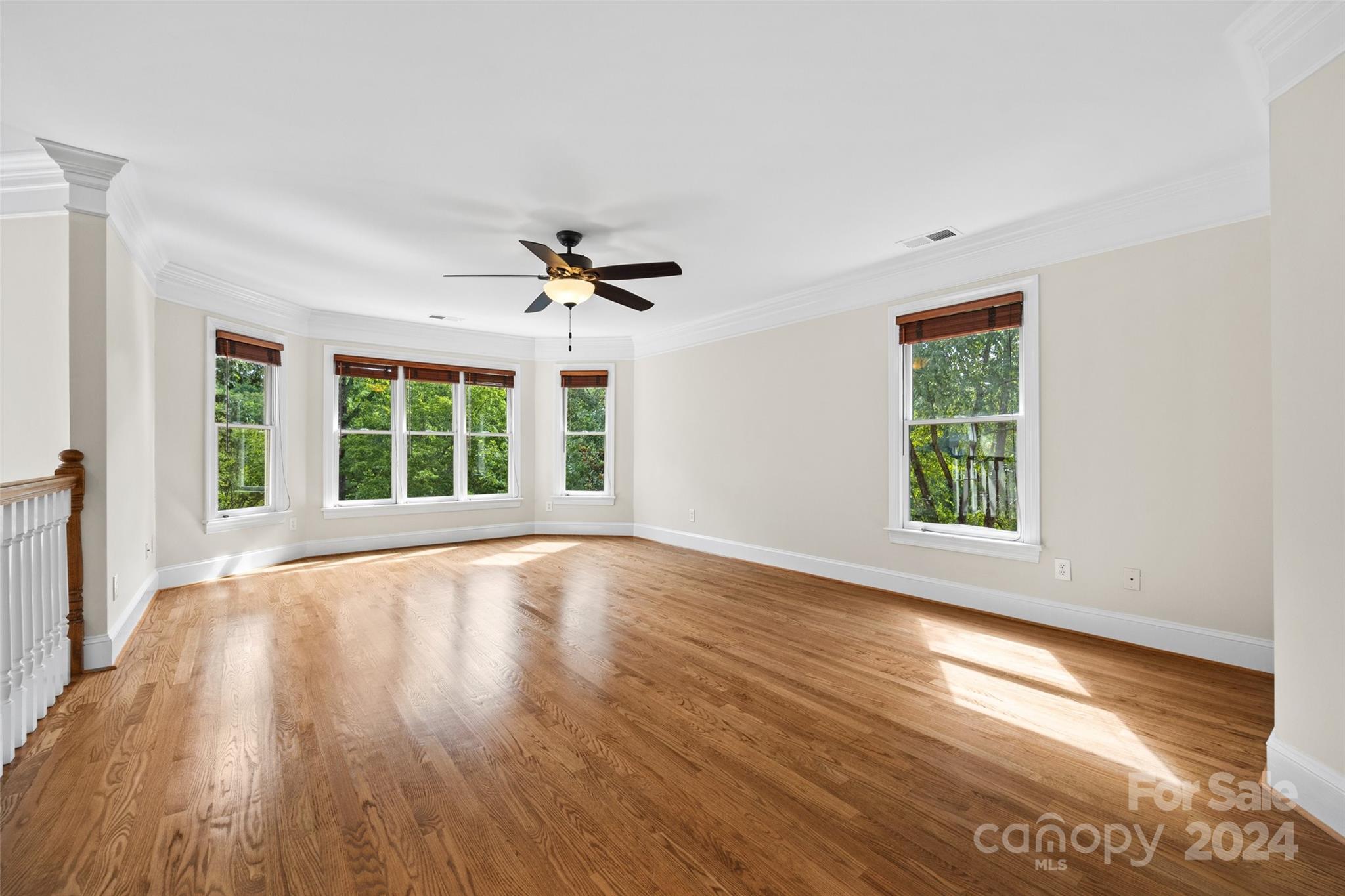 16201 Crest Cove Road Charlotte, NC 28278 - Photo 19 of 48 a view of an empty room with wooden floor and a window