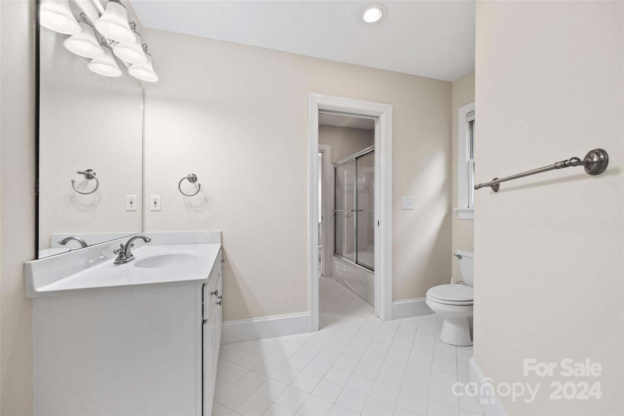 16201 Crest Cove Road Charlotte, NC 28278 - Photo 23 of 48 a bathroom with a sink toilet and shower