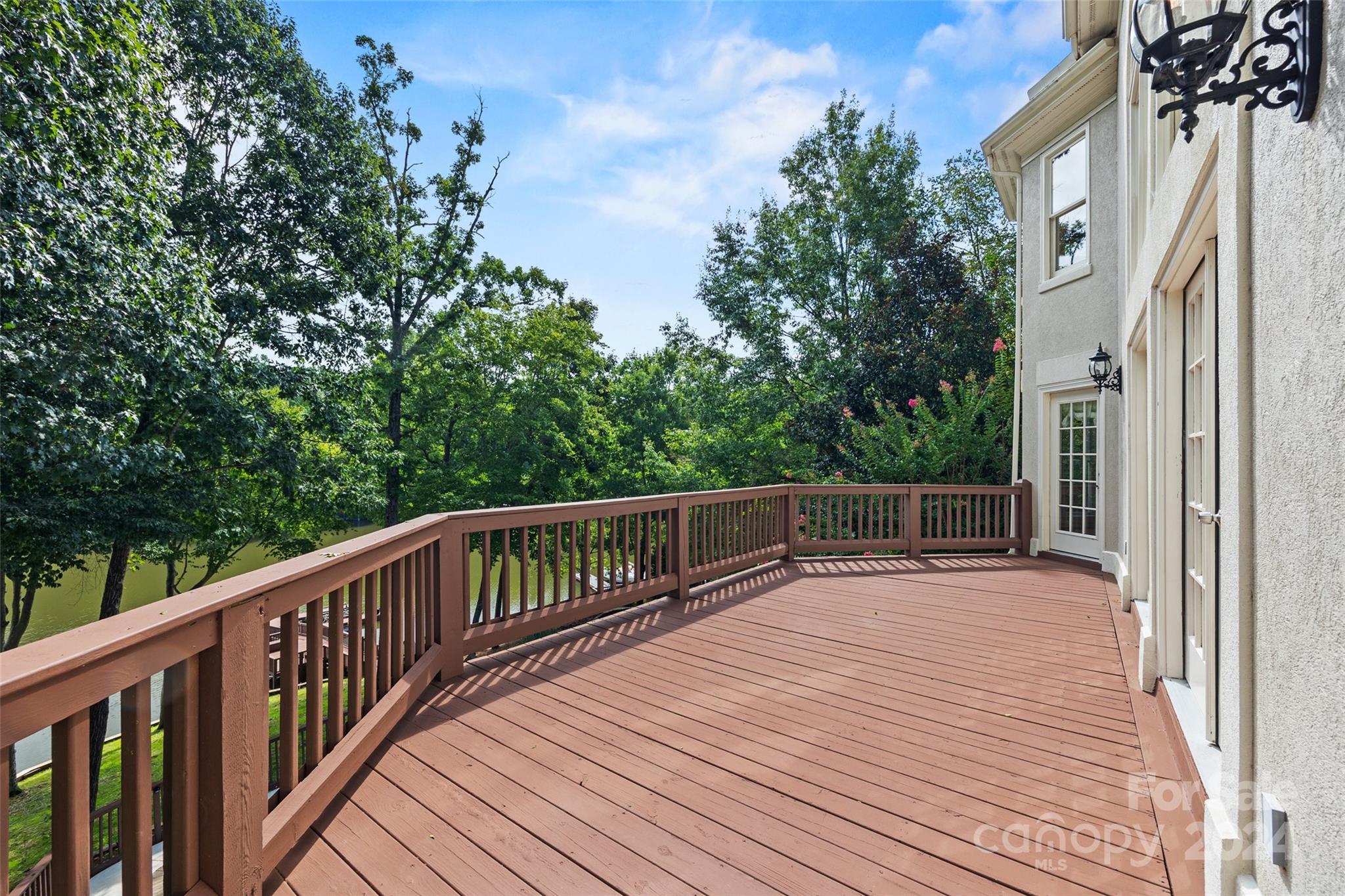 16201 Crest Cove Road Charlotte, NC 28278 - Photo 26 of 48 a balcony with wooden floor and fence