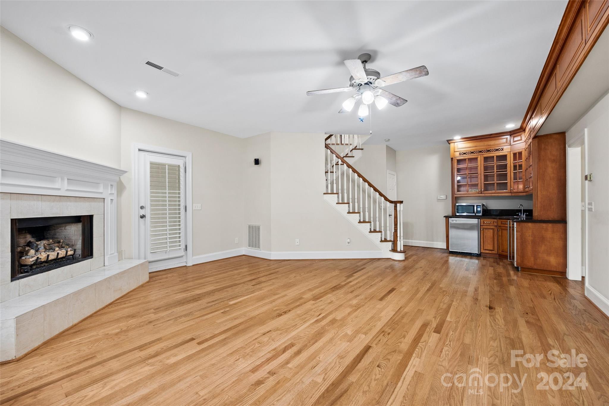 16201 Crest Cove Road Charlotte, NC 28278 - Photo 28 of 48 a view of empty room with wooden floor and fan