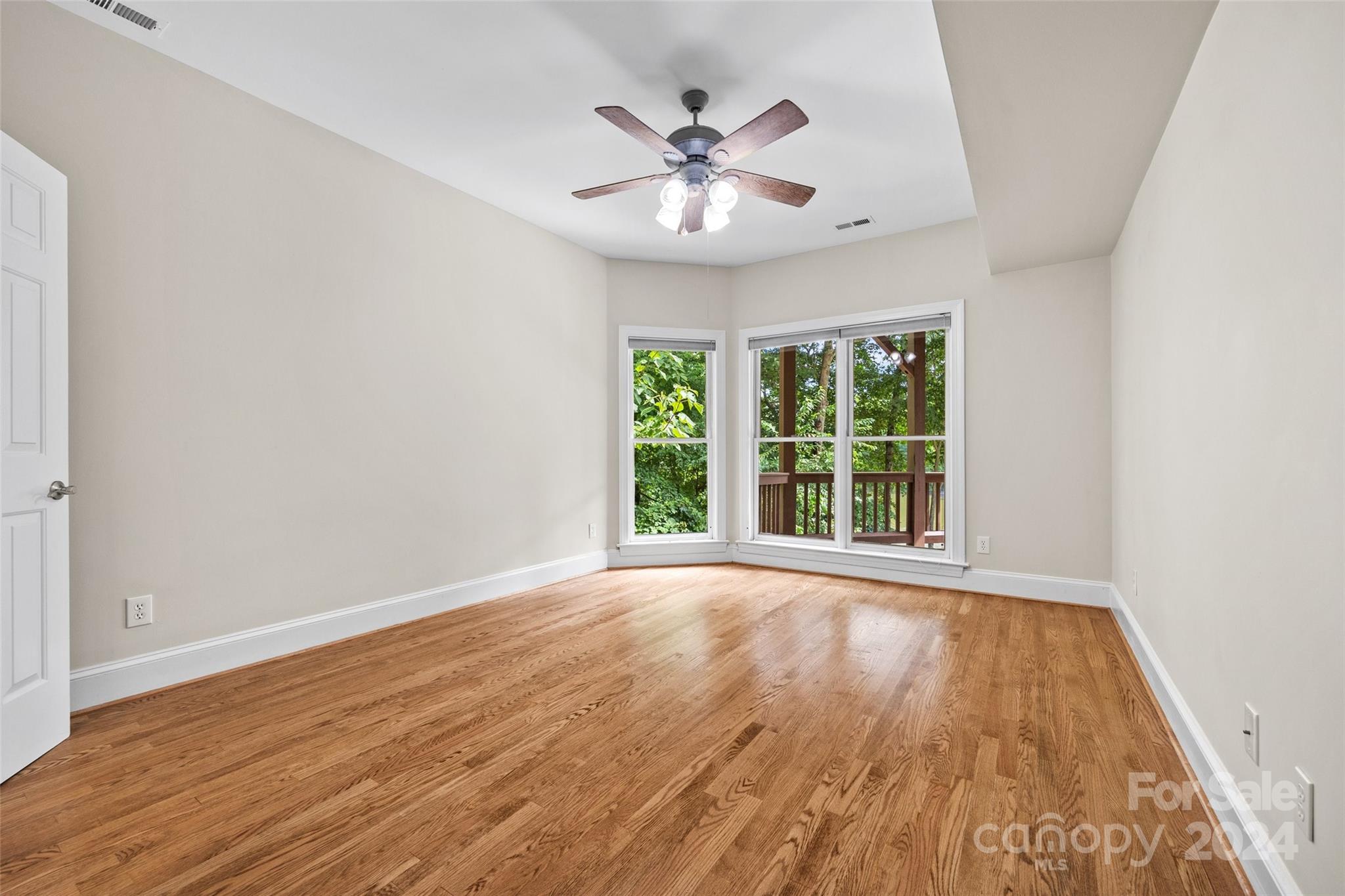 16201 Crest Cove Road Charlotte, NC 28278 - Photo 29 of 48 a view of an empty room with wooden floor and a window